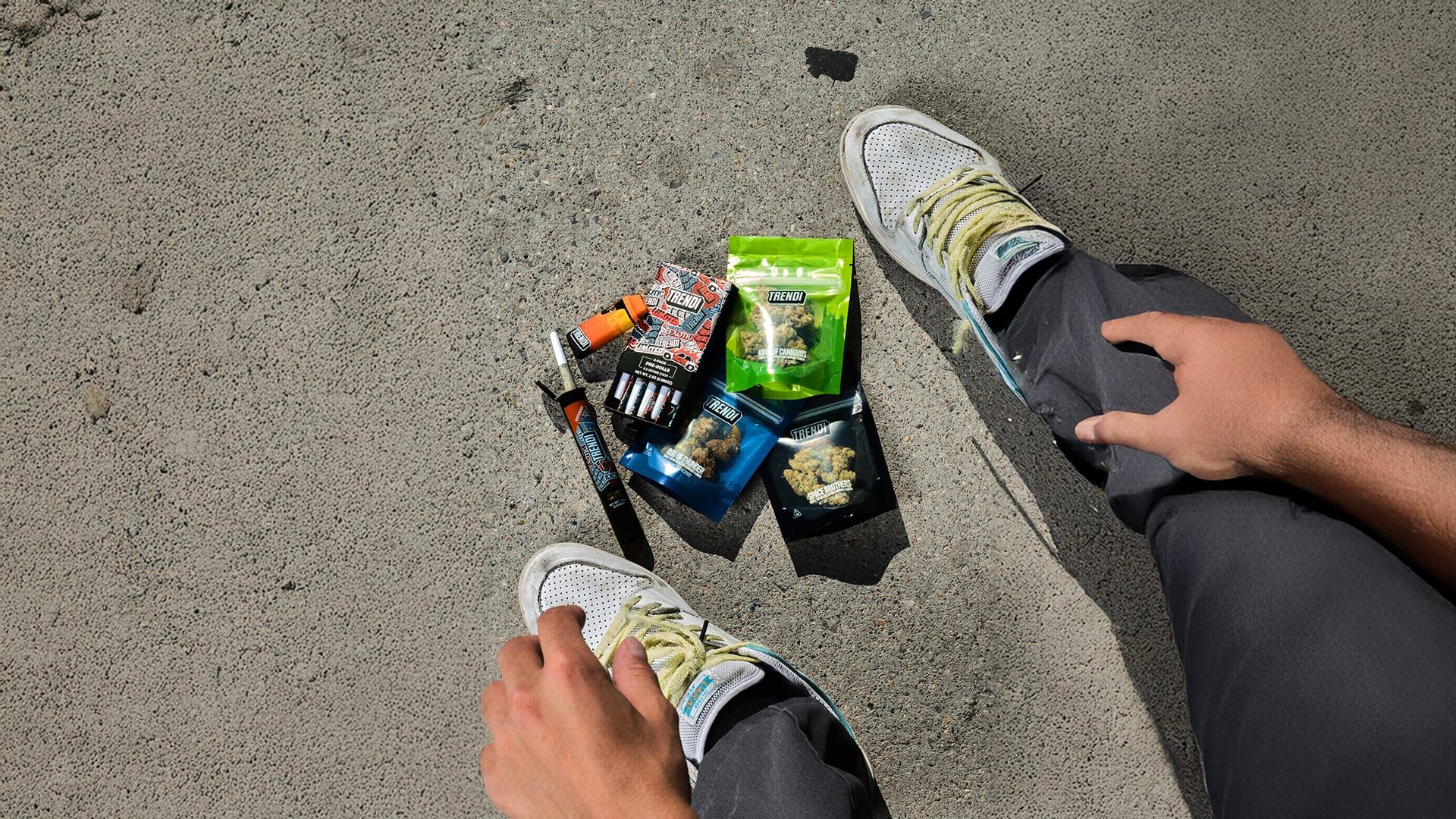 A skater mid-line above TRENDI packs at the skatepark